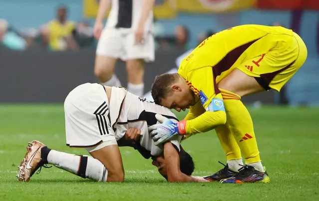 Goalkeeper Manuel Neuer of Germany and Jamal Musiala of Germany looks dejected during the FIFA World Cup Qatar 2022 Group E match between Costa Rica and Germany at Al Bayt Stadium on December 1, 2022 in Al Khor, Qatar. (Photo by Wolfgang Rattay/Reuters)