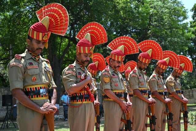 Border Security Force (BSF) soldiers pay respect during a wreath-laying ceremony for Constable Deepak Chingakham of the Border Security Force (BSF), who was martyred during a cross-border firing between India and Pakistan, in Jammu on May 12, 2025. Indian and Pakistani military chiefs were set to confer on May 12 as a ceasefire that brought the nuclear-armed rivals back from the brink of all-out war held. US President Donald Trump announced the truce late on May 10 after four days of missile, drone and artillery attacks which killed at least 60 people and sent thousands fleeing on both sides. (Photo by Money Sharma/AFP Photo)