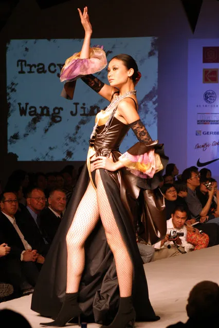 A model from China's top model agency Silk Road walks the runway at the graduation show of Raffles Lasalle, an international design school in Beijing. (Photo by Stringer)