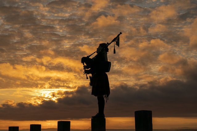 Scotland's National Piper Louise Marshall playing a lament to the fallen at dawn on Portobello Beach in Edinburgh, overlooking the Firth of Forth on the 80th anniversary of VE Day on Thursday, May 8, 2025. (Photo byh Jane Barlow/PA Wire)