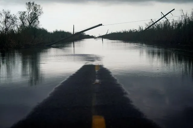 Downed power lines and flooding is seen after Hurricane Laura passed through the area in Creole, Louisiana, U.S. August 28, 2020. (Photo by Elijah Nouvelage/Reuters)