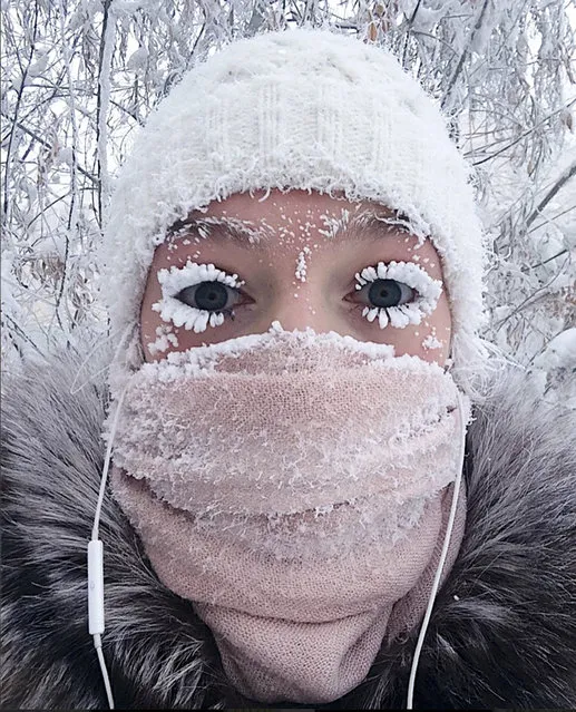 In this photo taken on Sunday, January 14, 2018, Anastasia Gruzdeva poses for selfie as the Temperature dropped to about –50 degrees (–58 degrees Fahrenheit) in Yakutsk, Russia. Temperatures in the remote, diamond-rich Russian region of Yakutia have dropped to near-record lows, plunging to –67 degrees Centigrade (–88.6 degrees Fahrenheit) in some areas. (Photo by Sakhalife.ru Photo via AP Photo)