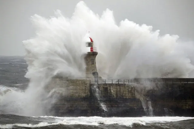 Giant waves crash over Souter Lighthouse in South Shields in Tynemouth, England, Friday, March 2, 2018 as extreme weather has continued to wreak havoc across the UK. (Photo by Owen Humphreys/PA Wire via AP Photo)