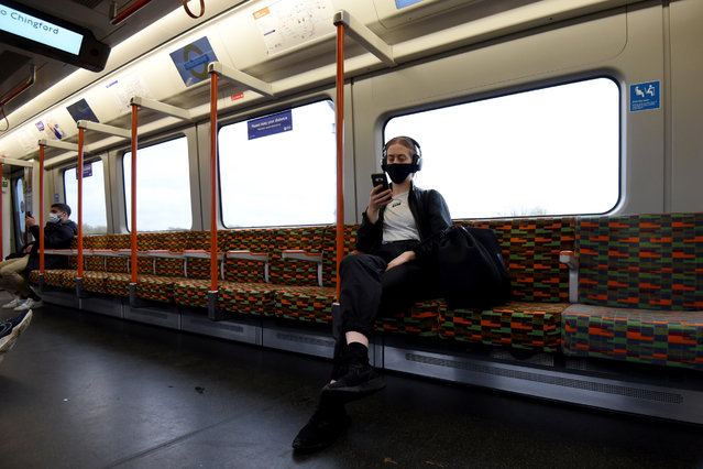 A passenger on the tube in central London on October 29, 2020. The coronavirus pandemic has reached a “critical stage” in England with 96,000 new infections in a single day and infections doubling every nine days, according to the Imperial College London (ICL) on Thursday. Health Secretary Matt Hancock announced that 16 more areas in England will move into Tier 2 restrictions, the second highest level, beginning Saturday. (Photo by Kate Green/Anadolu Agency via Getty Images)