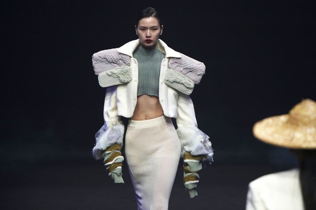 Models present a Dongfang Cup 2024 China Womenswear Design Competition Excellent Works by local designers during the SS2026 China Fashion Week, in Beijing, Monday, September 8, 2025. (Photo by Andy Wong/AP Photo)