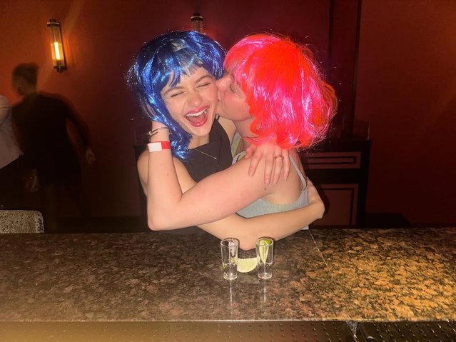 “Kissing Booth” star Joey King (in blue wig) and “Game of Thrones” alum Maisie Williams laugh it up while enjoying a night on the town full of shots and karaoke in the second decade of September 2025. (Photo by Joey King/Instagram)