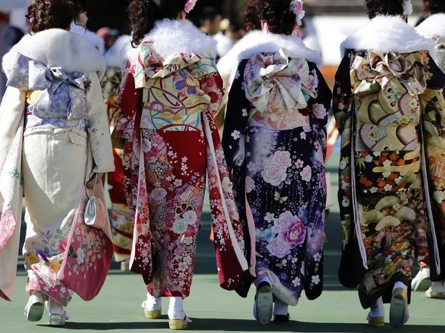 Japanese women in kimonos attend a Coming of Age Day celebration ceremony at an amusement park in Tokyo January 12, 2015. (Photo by Yuya Shino/Reuters)