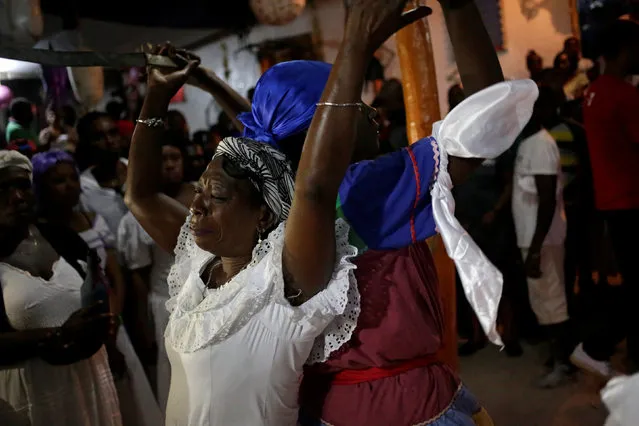 Voodoo believers celebrate a ceremony of Fet Gede in a Peristil, a voodoo temple, in Port-au-Prince, Haiti, November 1, 2016. (Photo by Andres Martinez Casares/Reuters)
