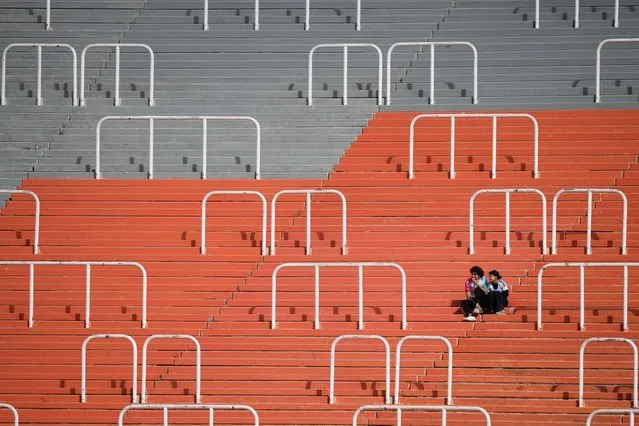Fans watch a FIFA U-20 World Cup Group F soccer match between France and South Korea at the Malvinas Argentinas stadium in Mendoza, Argentina, Monday, May 22, 2023. (Photo by Natacha Pisarenko/AP Photo)