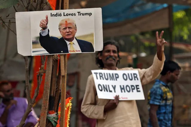 A member of Hindu Sena, a right-wing Hindu group, celebrate Republican presidential nominee Donald Trump's victory in the U.S. elections, in New Delhi, India, November 9, 2016. (Photo by Cathal McNaughton/Reuters)