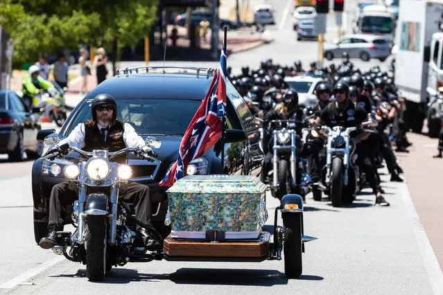 A motorcade follows the coffin of Rebels bikie Nick Martin to Pinnaroo Cemetery in Perth, Wednesday, December 23, 2020. Former Rebels president Nick Martin was gunned down earlier this month at the Perth Motorplex. (Photo by Richard Wainwright/AAP Image)