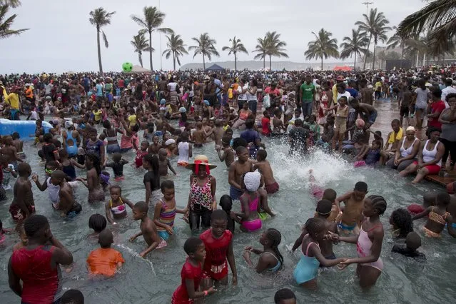 Beach goers celebrate New Year's Day in the paddling pools on the beachfront in Durban, South Africa, January 1, 2016. (Photo by Rogan Ward/Reuters)
