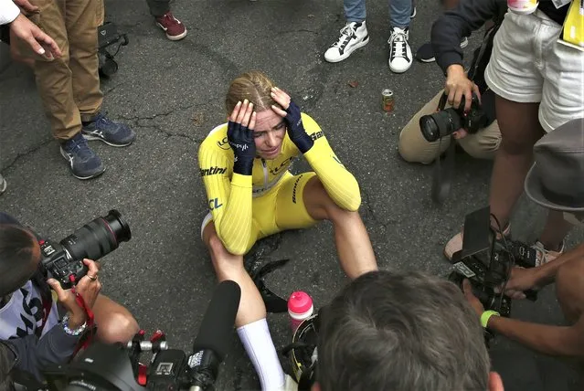 Winner of the Tour de France women's cycling race Netherland's Demi Vollering reacts after the eighth stage in Pau, southwestern France, Sunday, July 30, 2023. (Photo by Bob Edme/AP Photo)
