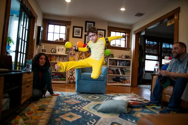 Reuben Goodman jumps during his 6th birthday Zoom party, after all family members have been vaccinated against the coronavirus disease (COVID-19), in South Orange, New Jersey U.S., April 17, 2021. (Photo by Eduardo Munoz/Reuters)