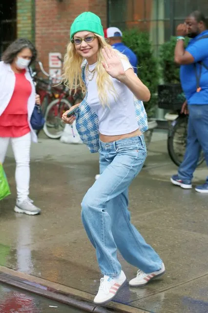 American model and television personality Gigi Hadid leaves a photoshoot at Bowery Hotel in a green cashmere hat, white crop top and jeans in New York City in the second decade of August 2023. (Photo by hristopher Peterson/Splash News and Pictures)