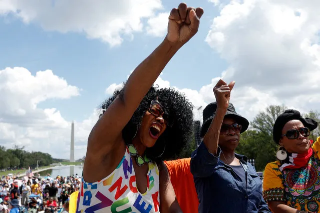 People gesture as demonstrators for racial justice gather on the 60th anniversary of the March On Washington and Martin Luther King Jr's historic “I Have a Dream” speech at the Lincoln Memorial, in Washington D.C, U.S., August 26, 2023. (Photo by Evelyn Hockstein/Reuters)