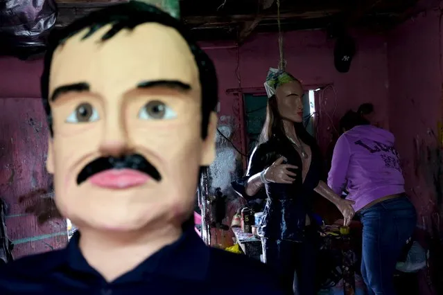 An artisan works on a pinata depicting Mexican actress Kate del Castillo near other pinata depicting the drug lord Joaquin "El Chapo" Guzman at a workshop in Reynosa, in Tamaulipas state, Mexico, January 13, 2016. (Photo by Daniel Becerril/Reuters)