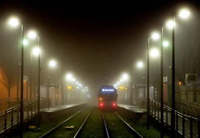 A subway train stands at a station in Frankfurt, Germany, on a foggy Friday morning, December 18, 2020, when Germany reached a record high of new corona infections. (Photo by Michael Probst/AP Photo)