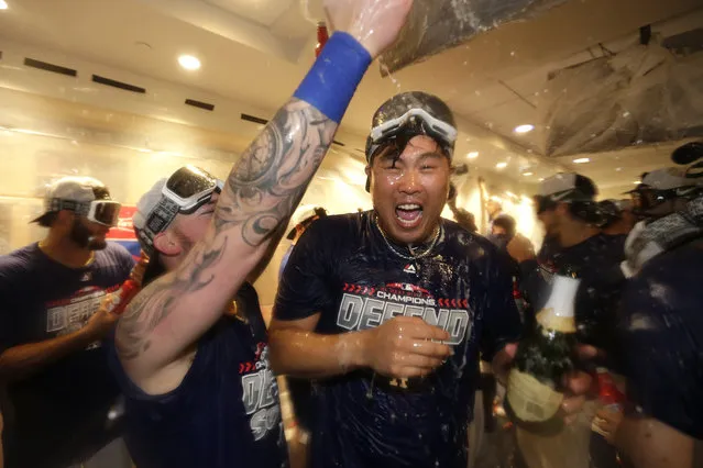 Los Angeles Dodgers starting pitcher Hyun-Jin Ryu, of South Korea, is sprayed with champaign by teammates in the clubhouse after the team's 5-2 win against the Colorado Rockies in a tiebreaker baseball game, Monday, October 1, 2018, in Los Angeles. (Photo by Jae C. Hong/AP Photo)
