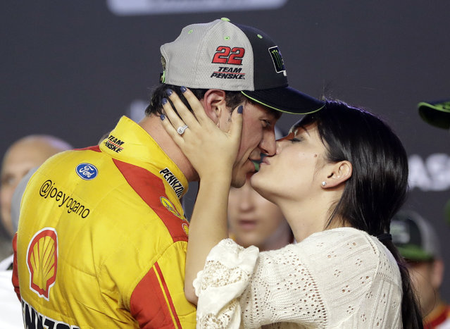 Joey Logano kisses his wife, Brittany Baca, after winning the NASCAR Cup Series championship auto race at Homestead-Miami Speedway, Sunday, November 18, 2018, in Homestead, Fla. (Photo by Lynne Sladky/AP Photo)