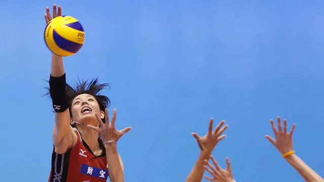 Japan's Saori Sakoda spikes the ball against Thailand during their FIVB Women's Volleyball Grand Champions Cup 2013 in Tokyo November 15, 2013. (Photo by Yuya Shino/Reuters)