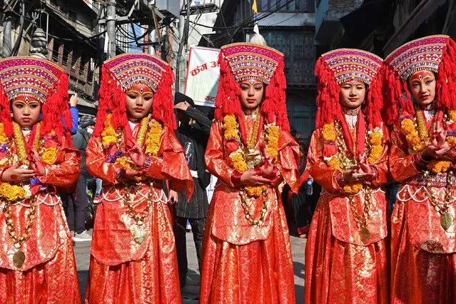 Members of the Nepali ethnic Newar community participate in a procession to mark “Jyapu Day” celebrations that marks the end of the harvest season, in Kathmandu on December 26, 2023. (Photo by Prakash Mathema/AFP Photo)