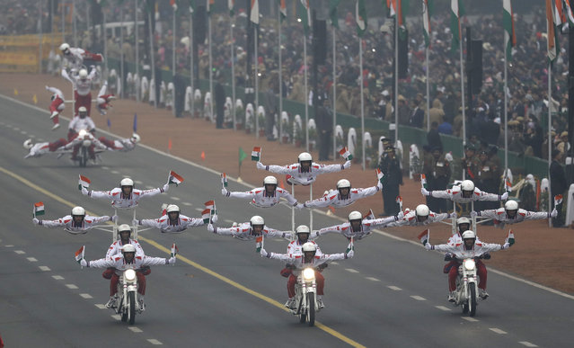 Indian Army daredevils display their skills on motorcycles during Republic Day parade in New Delhi, India, Thursday, January 26, 2017. India celebrates Republic day with parades across the country, showcasing India’s military might and economic strength. (Photo by Manish Swarup/AP Photo)