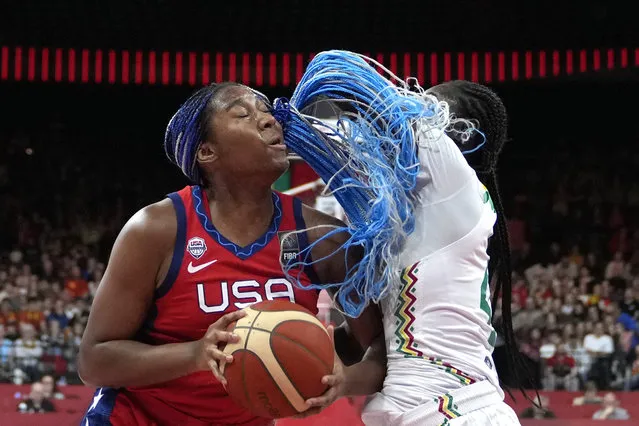 Senegal's Mathilde Diop, right, guards against United States Jewell Loyd during a Women's Olympic Qualifying group A basketball match between United States and Senegal in Antwerp, Belgium, Sunday, February 11, 2024. (Photo by Virginia Mayo/AP Photo)