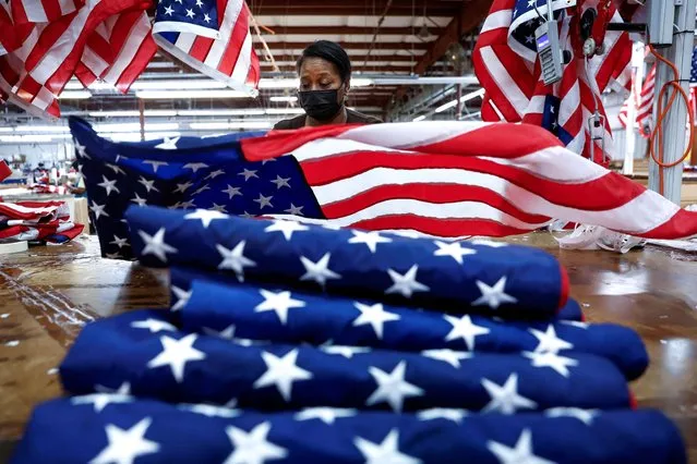Barbara McClorin inspects U.S. flags made at Valley Forge Flag’s manufacturing facility in Lane, South Carolina, U.S., February 22, 2024. (Photo by Evelyn Hockstein/Reuters)