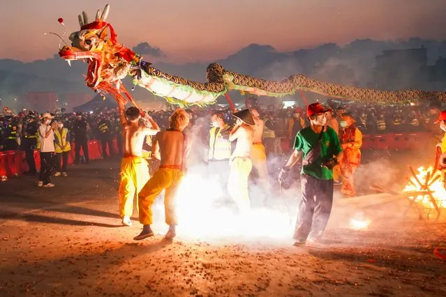 Dragon dancers perform at the traditional Paolong Festival in Binyang County, Nanning City, south China's Guangxi Autonomous Region on February 20, 2024. (Photo by Splash News and Pictures)