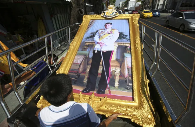 In this April 29, 2019, photo, Thai workers prepare to transport a giant portrait of Thailand's King Maha Vajiralongkorn by truck to a buyer's house in Bangkok, Thailand. The coronation ceremonies for 66-year-old King Maha Vajiralongkorn, also known as King Rama X, will be held on May 4-6, 2019. (Photo by Sakchai Lalit/AP Photo)