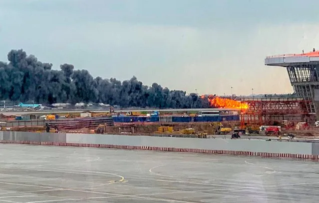 A picture taken on May 5, 2019, shows a fire of a Russian-made Superjet-100 at Sheremetyevo airport outside Moscow. The Interfax agency reported that the plane, a Russian-made Superjet-100, had just taken off from Sheremetyevo airport on a domestic route when the crew issued a distress signal. At least one person is died according to Russian agencies. (Photo by Viktor Marchukaites/AFP Photo)