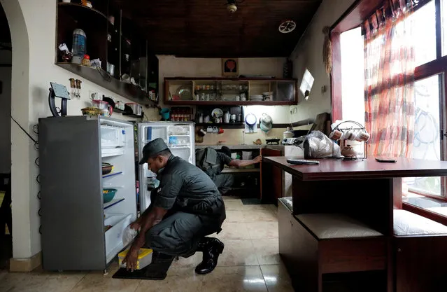 Sri Lankan army soldiers search a house during a special cordon and search operation conducted by the military in Sri Lanka's capital Colombo and suburbs, five weeks after Easter Sunday bomb attacks, in Mattegoda, Sri Lanka on May 25, 2019. (Photo by Dinuka Liyanawatte/Reuters)