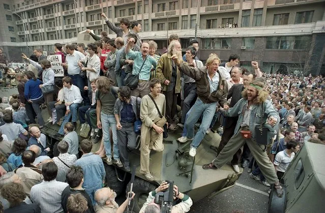 A crowd gathers around a personnel carrier as some people climb aboard the vehicle and try to block its advance near Red Square in downtown Moscow, Russia, on August 19, 1991. The August 1991 coup that briefly ousted Soviet leader Mikhail Gorbachev collapsed in just three days, precipitating the breakup of the Soviet Union that plotters said they were trying to prevent. Former Soviet leader Gorbachev has died Tuesday Aug. 30, 2022 at a Moscow hospital at age 91. (Photo by Boris Yurchenko/AP Photo/File)
