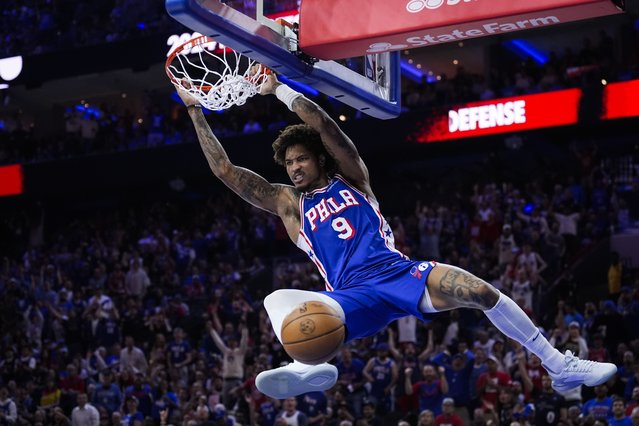 Philadelphia 76ers' Kelly Oubre Jr. hangs from the rim after dunking against the New York Knicks during the second half of Game 6 in an NBA basketball first-round playoff series Thursday, May 2, 2024, in Philadelphia. (Photo by Matt Slocum/AP Photo)