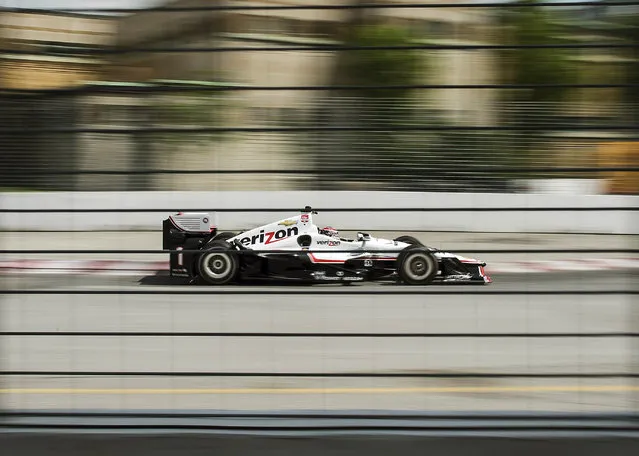 Will Power, of Australia, accelerates around a corner during practice for the IndyCar auto race Saturday, June 13, 2015, in Toronto. (Aaron Vincent Elkaim/The Canadian Press via AP)