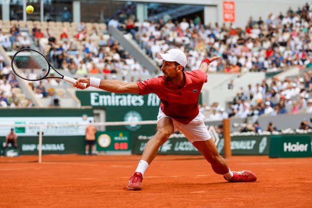 Serbia's Novak Djokovic plays a shot against Argentina's Francisco Cerundolo during their fourth round match of the French Open tennis tournament at the Roland Garros stadium in Paris, Monday, June 3, 2024. (Photo by Jean-Francois Badias/AP Photo)