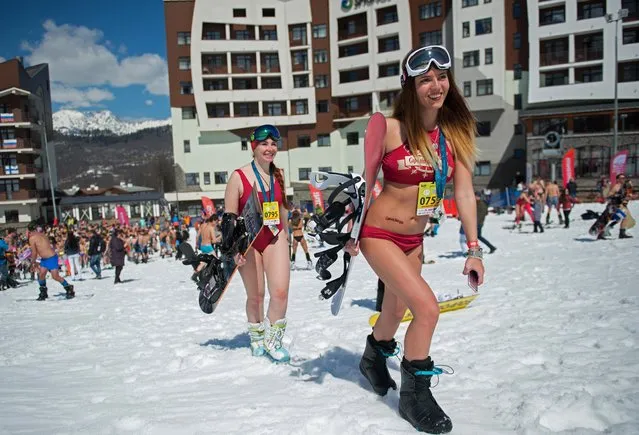 People dressed in swimsuits participate in the BoogelWoogel alpine carnival at the Rosa Khutor Alpine Resort in Krasnaya Polyana, Sochi, Russia on April 1, 2017. (Photo by Artur Lebedev/TASS)