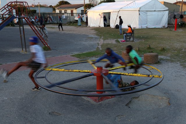 Children play in front of a polling station during the South African elections, in Cape Town, South Africa on May 29, 2024. (Photo by Esa Alexander/Reuters)