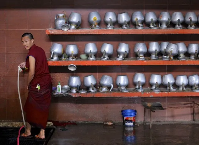 A Tibetan monk washes his feet in a community kitchen during celebrations to mark the 80th birthday of the Tibetan spiritual leader, the Dalai Lama, at the Sera Jey Monastery in Bylakuppe in the southern state of Karnataka, India, July 6, 2015. (Photo by Abhishek N. Chinnappa/Reuters)