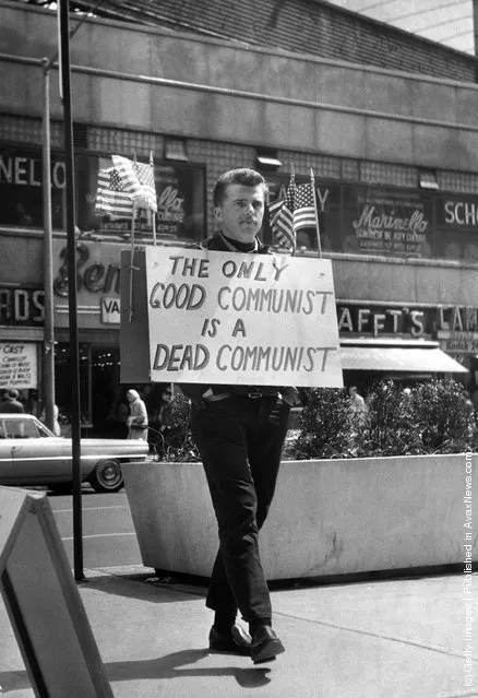 1965: New York nightclub owner Jack L Hickman spends his free time marching around Times Square with a sign that reads 'The only good communist is a dead communist'
