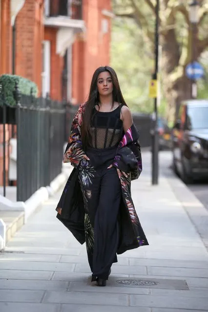 Cuban-American singer-songwriter Camila Cabello is seen wearing Dries van Noten suit with floral print & flared pants in black, Dion Lee black sheer top, black heeled shoes on March 24, 2022 in London, England. (Photo by Christian Vierig/GC Images)