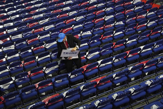 A volunteer prepare before the Republican National Convention Monday, July 15, 2024, in Milwaukee. (Photo by Julia Nikhinson/AP Photo)