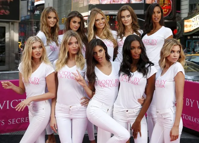 The newest Victoria's Secret “Angels” models pose for photographers in New York's Times Square during the launch of the new “Body by Victoria” campaign July 28, 2015. From L-R front row are Elsa Hosk, Martha Hunt, Sara Sampaio, Jasmine Tookes and Stella Maxwell. From L-R back row are Kate Grigorieva, Taylor Hill, Rommee Strijd, Jac Jagaciak and Lais Ribeiro. (Photo by Mike Segar/Reuters)