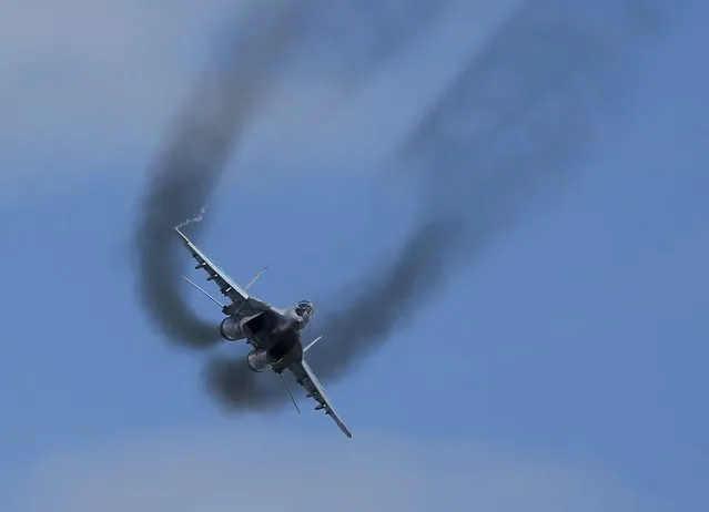 A MIG-29 fighter performs during the “Aviadarts” military aviation competition at the Dubrovichi range near Ryazan, Russia, August 2, 2015. (Photo by Maxim Shemetov/Reuters)