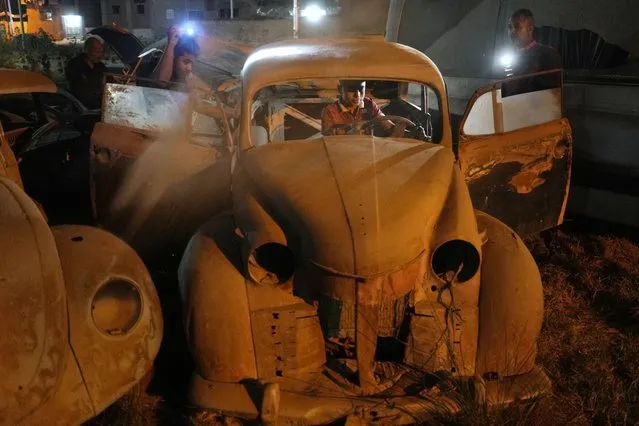 Mechanics check a German made Opel Olympia, model 1952, in El Saff city just outside Cairo, Egypt, Friday, April 8, 2022. (Photo by Amr Nabil/AP Photo)