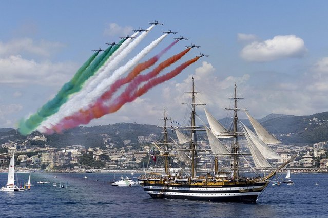 Planes release smoke in the colors of the Italian flag over the ship “Amerigo Vespucci” as it leaves from Genoa on world tour, Genoa, Italy, 01 July 2023. Italian naval academy flagship sailboat Amerigo Vespucci, one of the world's most iconic “tall ships”, is to take Italian products in “Made in Italy” global tour for 20 months visiting 28 countries and 31 ports. (Photo by Massimo Percossi/EPA/EFE)