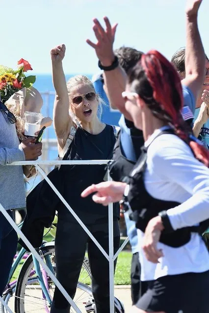 Sarah Michelle Gellar and her daughter Charlotte cheer on a friend running in the Los Angeles Marathon in Santa Monica, CA. on March 8, 2020. (Photo by Backgrid USA)