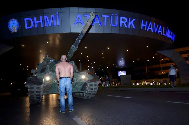 A man stands in front of a Turkish army tank at Ataturk airport in Istanbul, Turkey July 16, 2016. (Photo by Reuters/IHLAS News Agency)
