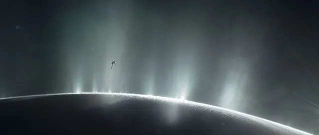 This handout illustration obtained April 13, 2017 courtesy of NASA,  shows NASA's Cassini spacecraft diving through the plume of Saturn's moon Enceladus, in 2015. Two veteran NASA missions are providing new details about icy, ocean-bearing moons of Jupiter and Saturn, further heightening the scientific interest of these and other “ocean worlds” in our solar system and beyond. (Photo by AFP Photo/NASA)